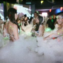 2010 June 24_ HLF Foam 928_ IBIZA Foam Party at Paparazzi Nightclub at Ward Centre.Partygoers in the foam.Honolulu Star-Advertiser photo by FL Morris